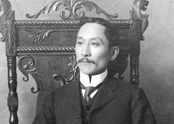 Won Alexander Cumyow seated in an ornate chair.