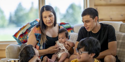 Indigenous family with three young children