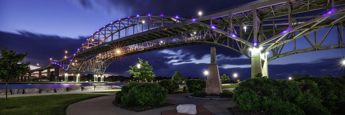 The Blue Water Bridge The Blue Water Bridge links Port Huron, Michigan to Sarnia, Ontario.